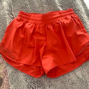 Size 6 tall Lululemon shorts orange-red color